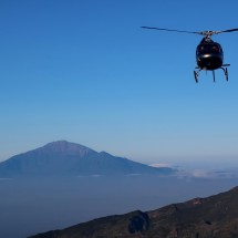 Approaching helicopter with Mount Meru